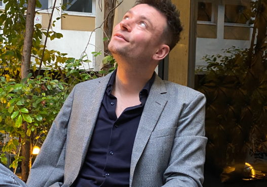 Michael sitting in a café